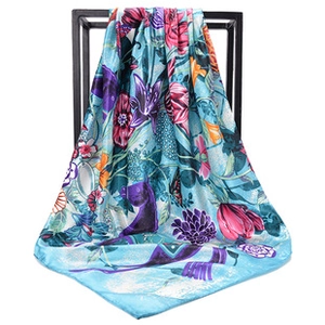 Detail of 90x90cm satin square scarf featuring vibrant floral and horse print patterns