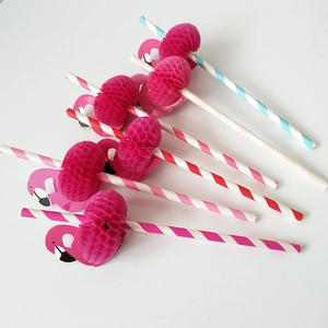 Macro detail of flamingo paper straws with pink honeycomb decor and colorful stripes