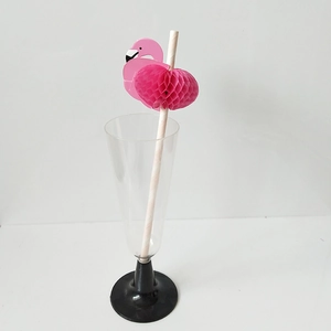 Detailed view of pink striped paper straw featuring a honeycomb flamingo party decoration