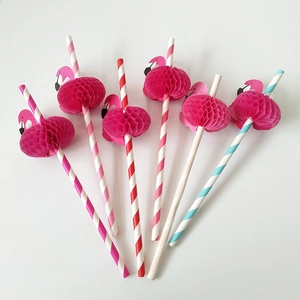 Close-up of pink flamingo honeycomb paper straws with vibrant colorful stripes for parties