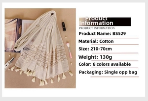 Detailed view of cream lace cotton scarf with tassel trim showing 210x70cm dimensions