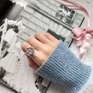 Close-up of vintage 925 sterling silver cross ring with an antique finish on model