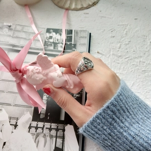 Retro 925 sterling silver cross ring worn on finger with vintage embossed textures