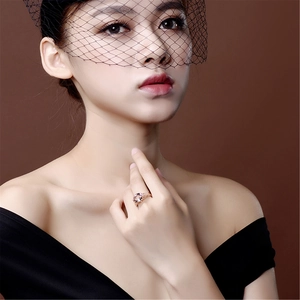 Elegant 18K rose gold plated ring with oval morganite gemstone worn by a fashion model
