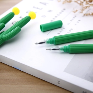 Creative cactus-shaped green gel pens with yellow cap detail on a wooden desk