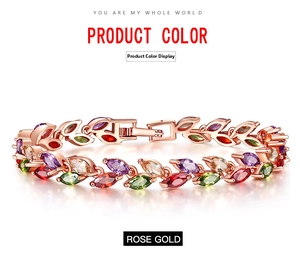 Detailed close-up of rose gold leaf bracelet with multi-color zircon stones and clasp