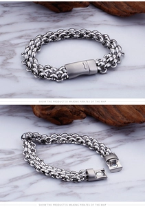 Close-up of a mens stainless steel double-row woven chain bracelet with a magnetic clasp