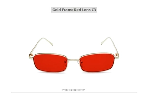 Detalle frontal de gafas de sol retro con montura metálica dorada y lentes rojas