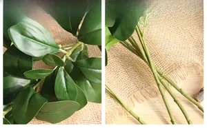 Close-up of artificial Milan green leaves showing detailed veins and realistic stems