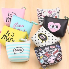 Detailed view of colorful pop art silicone coin purses with zippers and graphic prints