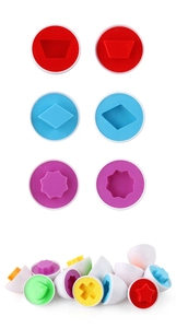 Close-up of colorful shape matching toy eggs showing internal geometric pairing details