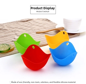 Detailed view of four-color food grade silicone egg poachers on a rustic kitchen tablecloth