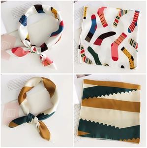 Detailed view of colorful pop art and geometric zigzag printed satin silk square scarves