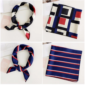 Detailed view of silk square scarves with geometric prints and professional hemmed edges