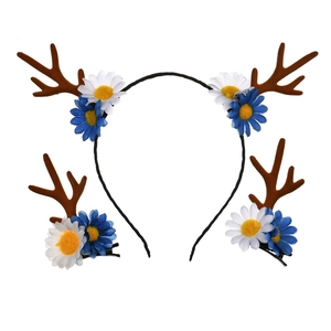 Detail view of brown reindeer antlers and daisy flowers on hair clips and headband set