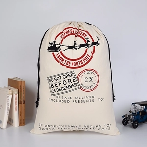 Detail of Christmas canvas Santa sack with reindeer print and black cotton drawstring