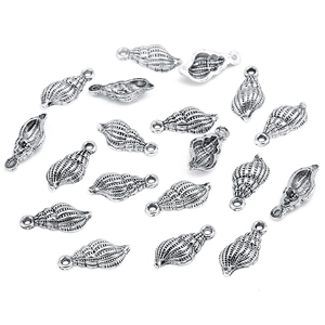 Macro view of silver alloy conch shell charms for DIY jewelry making accessories