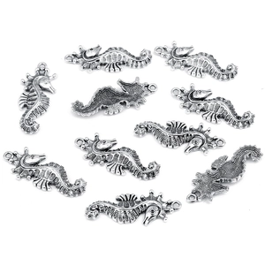 Macro shot of seahorse alloy charms in vintage silver finish for DIY jewelry making