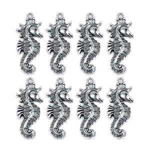 Detailed macro view of eight seahorse-shaped metal pendants with antique silver finish