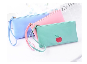Detailed view of colorful cartoon PU leather pouches with wristlets in soft pastel colors