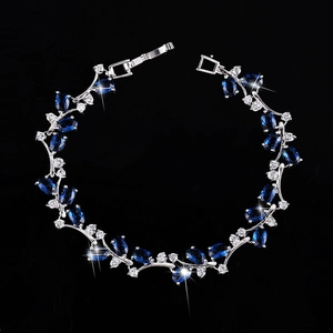 Elegant 18K white gold plated bracelet with deep blue oval gems and sparkling diamonds