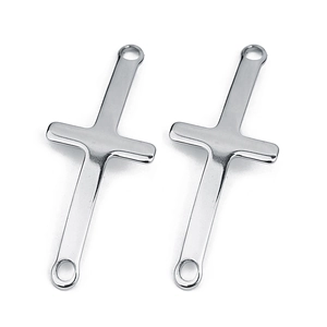 Close-up of dual-hole silver stainless steel curved cross connectors with a polished finish