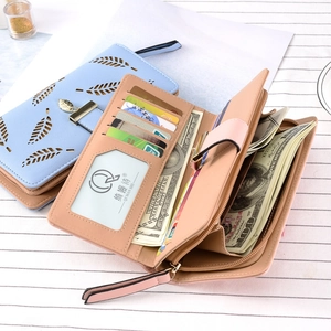 Fashionable long bi-fold women's wallet featuring hollow leaf pattern and multi-card slots