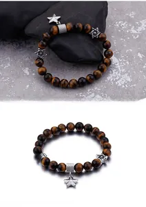 Detailed view of tiger eye stone bracelet with hexagram beads and star pendant accents