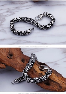 Detail of vintage titanium steel skull bracelet with Byzantine chain and Greek key pattern