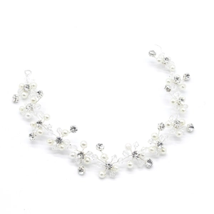 Detail of silver bridal hair vine with white pearls and clear crystal floral patterns