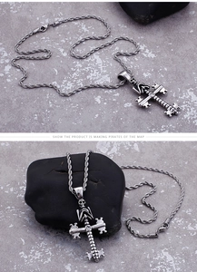 Detailed view of stainless steel skull key cross pendant with elegant twist chain