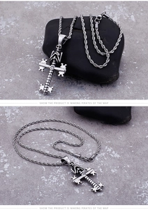 Close-up of gothic stainless steel skull cross pendant with rope chain and inlaid zircon