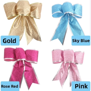 Detail of Christmas glitter bows in gold, sky blue, rose red and pink for tree decoration