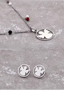 Detailed view of titanium steel angel silhouette jewelry set with pearl and color beads