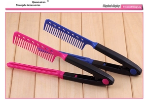 Close-up of V-shaped hair styling combs in blue and pink with heat-vented bristles