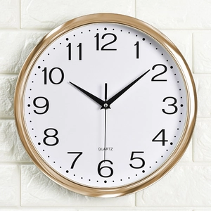 12-inch round wall clock with champagne gold frame and white dial featuring black numbers