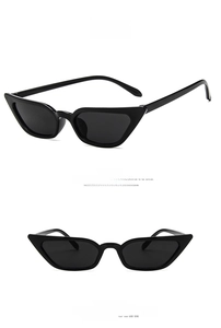Vertical split view of glossy black cat-eye sunglasses with dark gray lenses in detail