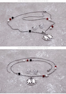 Detail of titanium steel jewelry set featuring boy and girl pendants with tri-color beads