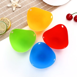 Set of four colorful silicone egg poachers in yellow, green, red, and blue colors