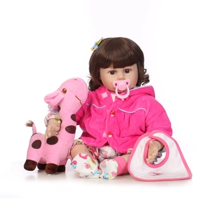 Realistic reborn baby doll with pink hoodie, giraffe plush toy and pacifier on white background