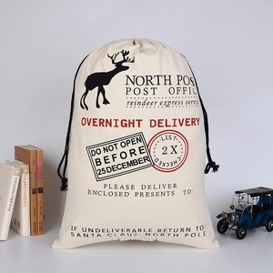 Detailed view of canvas Santa Sack with North Pole Post Office print and drawstring closure