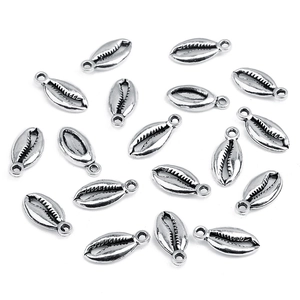 Flat lay of 16 silver alloy cowrie shell pendants with loops for DIY bracelet making