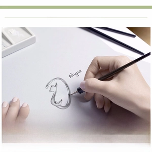 Artistic detail of s925 silver cat ring with a hand-drawn creative design concept