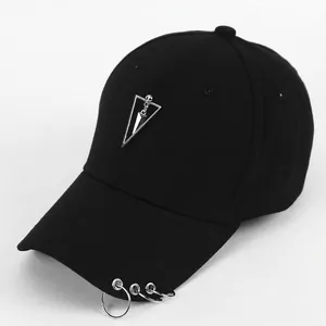 Black cotton baseball cap with silver metal rings and triangle pendant in punk style