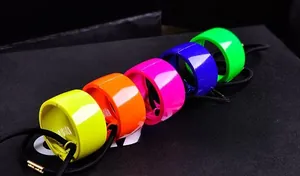Set of five vibrant neon hair rings in yellow, orange, pink, blue, and green colors