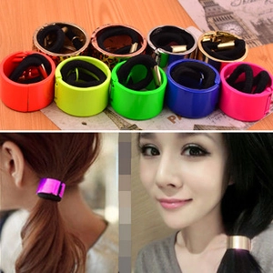 Close-up of vibrant elastic hair ties with colorful metallic and leopard print cuffs