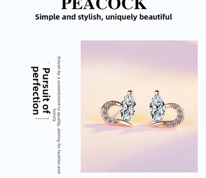 Macro detail of heart-shaped rose gold stud earring with marquise-cut cubic zirconia