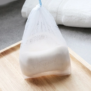 Double-layered nylon mesh foaming bag with blue drawstring for soap and facial cleanser