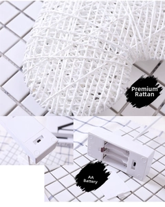 Detail of heart-shaped rattan lamp with AA battery compartment and manual toggle switch