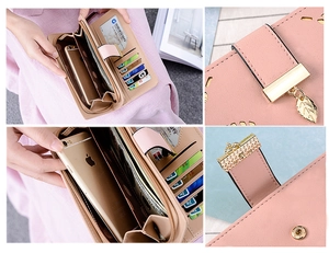 Pink PU leather wallet detail showing internal card slots and leaf pendant zip